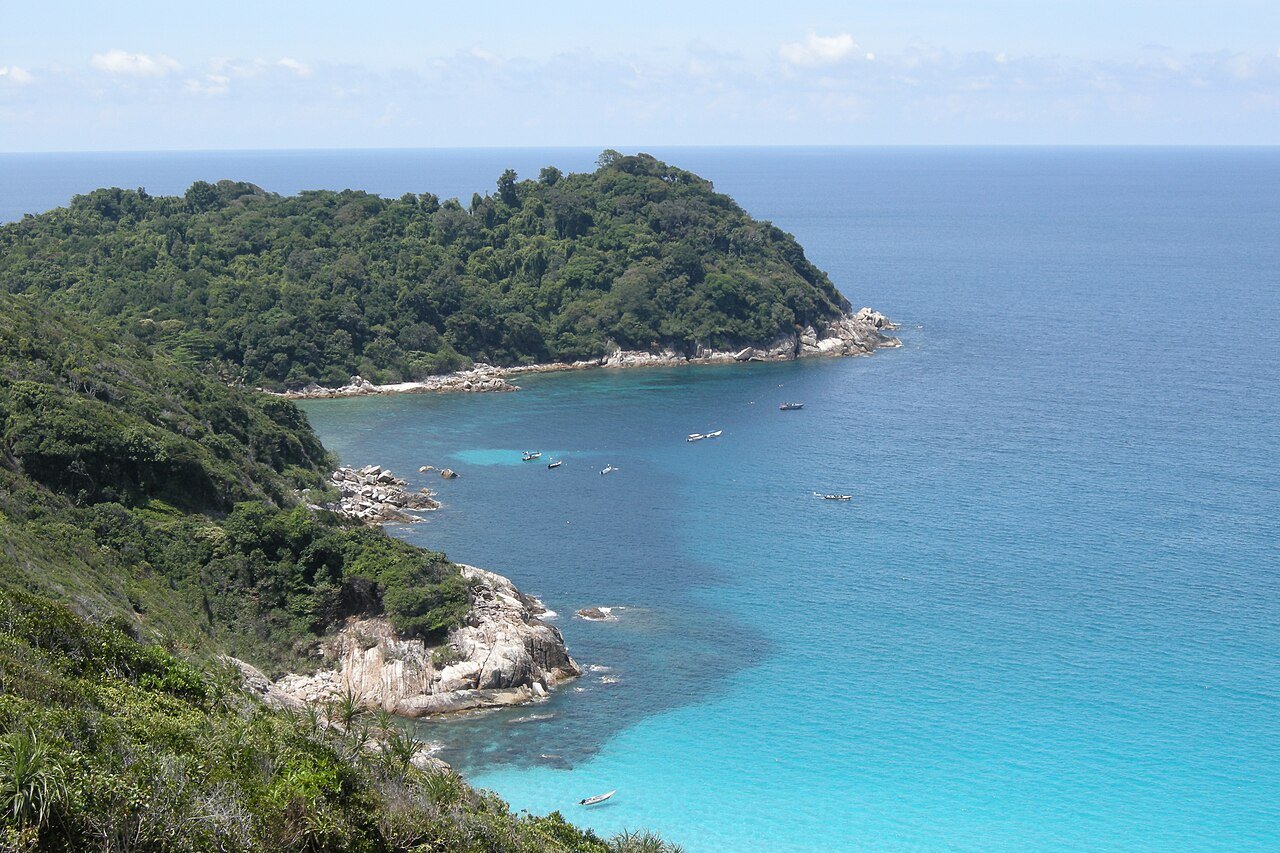 Turquoise water and forested coastline of the Perhentian Islands